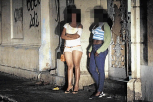 night shift: Sex workers at Rua da Araujo Street in downtown Maputo, Mozambique, ply their trade