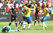 Percy Tau celebrates with teammates after scoring against Orlando Pirates at Loftus Stadium on Saturday. 