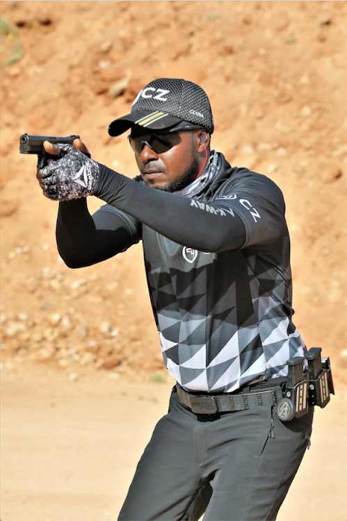 Bamburi Rifle Club's Ibrahim Ndung'u in action during the Kenya Open IPSC Championships at Shaba Shooting Range