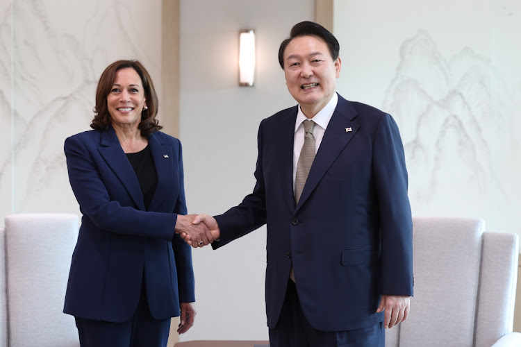 South Korean President Yoon Suk-yeol (right) shakes hands with US vice-president Kamala Harris during their meeting at the presidential office on September 29 2022 in Seoul, South Korea. Picture: SOUTH KOREAN PRESIDENTIAL OFFICE VIA GETTY IMAGES