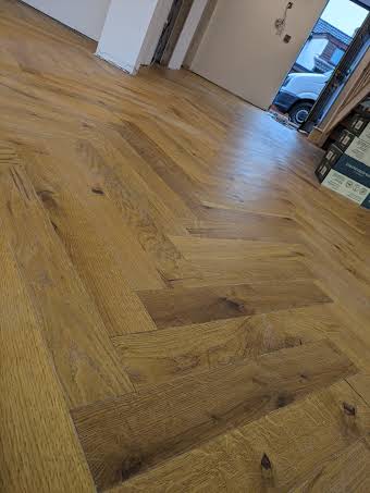 Engineered oak herringbone to the whole downstairs and top floor bedroom   album cover