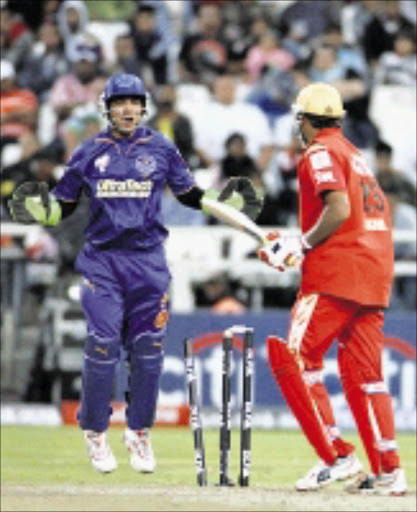 HE'S OUT: Bangalore Royal Challengers' Balachandra Akhil, right, is bowled out by Rajasthan Royals' Shane Warne, unseen, during the Indian Premier League Twenty20 cricket match in Cape Town, South Africa, Saturday, April 18, 2009. (AP Photo/Schalk van Zuydam)