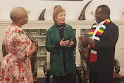 Graça Machel and Mary Robinson, deputy chair of The Elders, meet Zimbabwe's President Emmerson Mnangagwa in Harare in September 2019