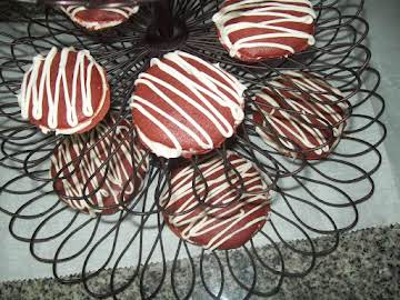 Red velvet whoopie pies with a cream cheese icing.