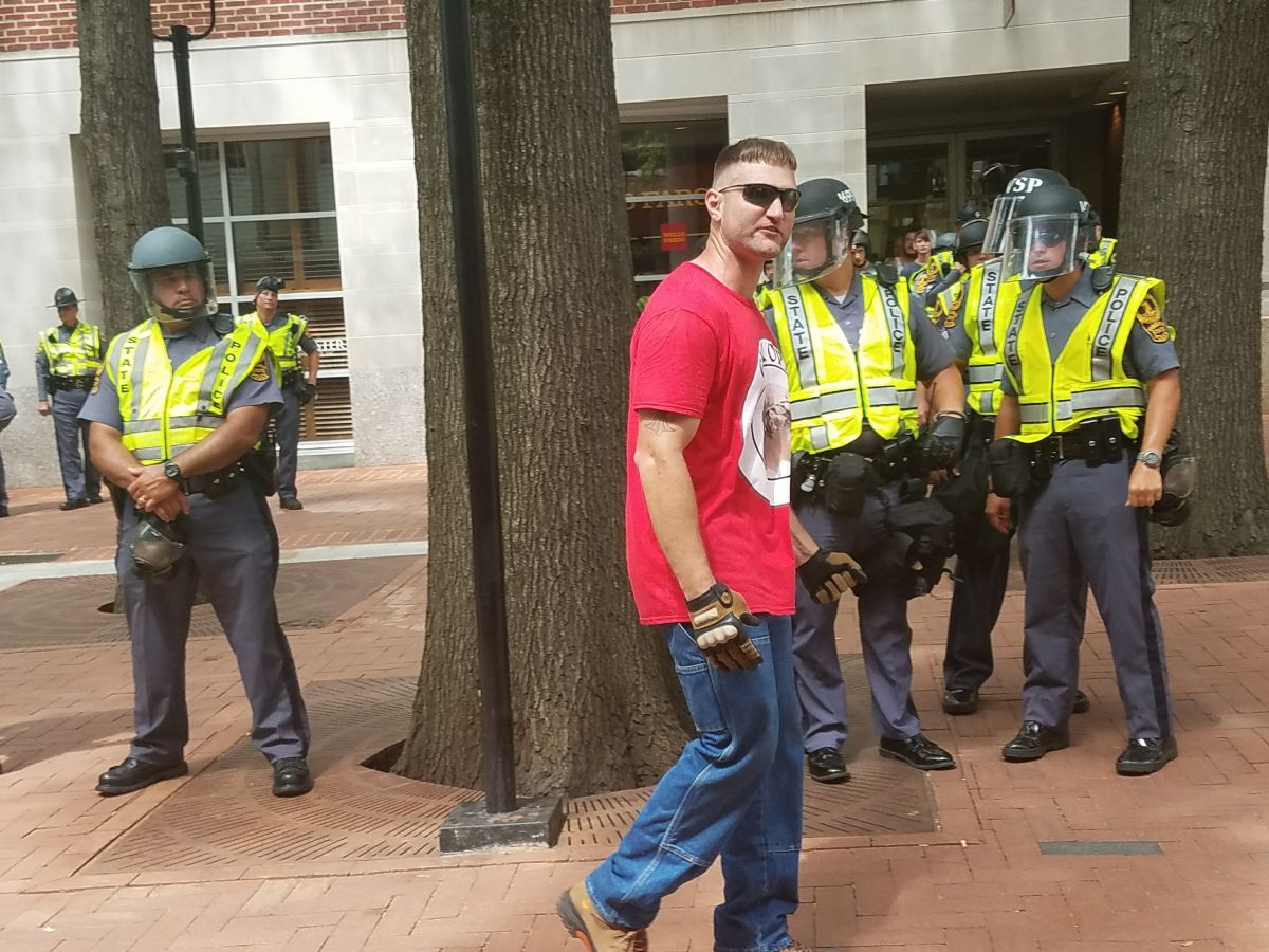 A protester at wearing a Evropa T-shirt yelling epithets. (Photo by Adele Stan)