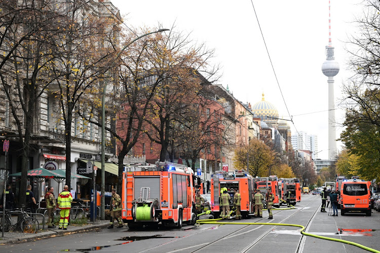 Firefighters work outside a restaurant on Oranienburger street in downtown Berlin, Germany, on October 31 2024.