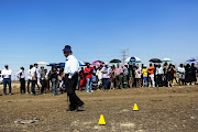 September 8 2014. George Bizos, who represented the families of the 34 dead miners during the Marikana strike, was part of the large crowd of lawyers, police officers, journalists and evidence leaders gathered in Marikana, North West, on Monday. 