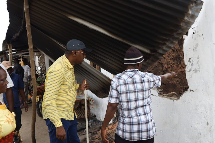 Lamu politician Eric Mugo visits the scene where four men were torched by assailants at Witho village last Sunday.