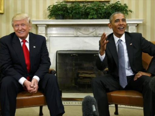 U.S. President Barack Obama (R) meets with President-elect Donald Trump to discuss transition plans in the White House Oval Office in Washington, U.S., November 10, 2016. Photo/REUTERS