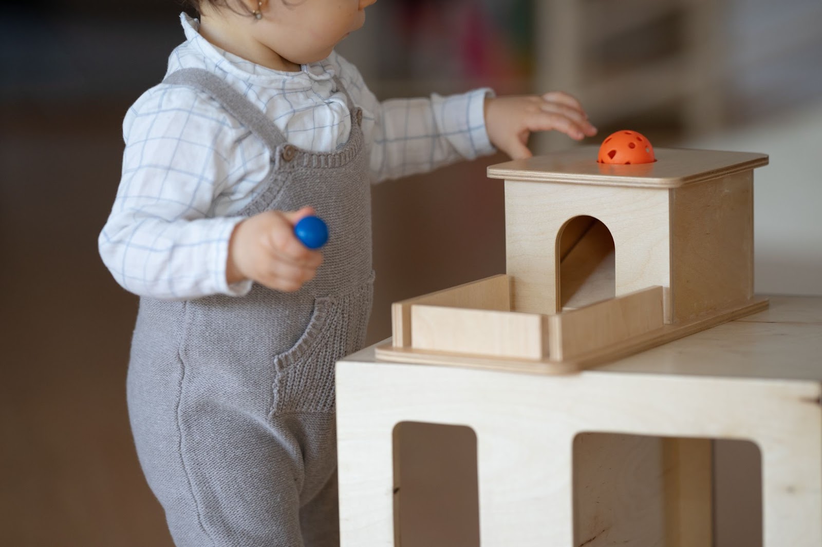 child playing in the montessori prepared environment