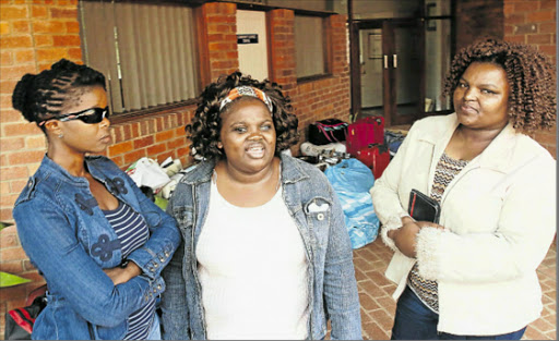 IN A FIX: SA council for teh blind members, from left Thandile Butana, Lutho Xintolo, and Nomthandazo Rasayi at Kenton-on-Sea police station following the forced removal of colleagues from the Cannon Rocks school after rental payments remianed unpaid. Picture: MICHAEL PINYANA