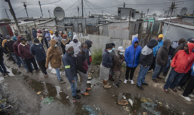 Voters queue at Samora Machel, near Cape Town. Picture: GALLO IMAGES /BRENTON GEACH