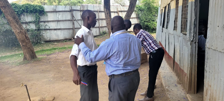 Kisumu Boys High School candidates being frisked ahead of Chemistry paper 1 exams.