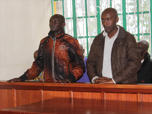 Murang'a Governor Mwangi wa Iria's supporters Stephen Chege and Edwin Gachuru in a Kangema court on July 27, 2017. /ALICE WAITHERA