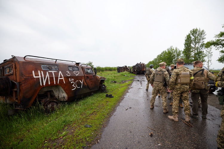 Ukraine's President Volodymyr Zelenskiy (not pictured) visits the scene of a fight with Russian troops during Russia's invasion to Ukraine, in Kharkiv region, Ukraine in this May 29 2022 file photo. Picture: HANDOUT via REUTERS