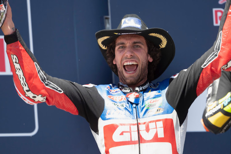 Alex Rins celebrates on the podium after winning the MotoGP of The Americas in Austin, Texas.