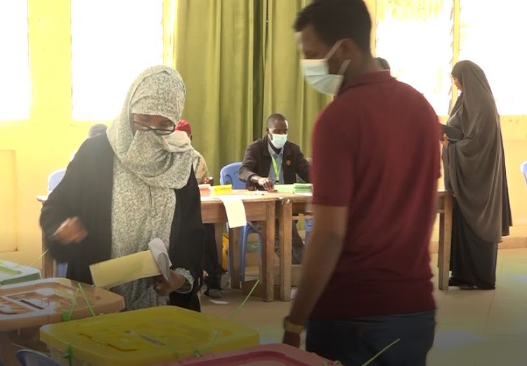 A woman casts her vote on August 9 at Jamhuri poling centre.