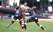 The Sharks' Lukhanyo Am and Rohan Janse van Rensburg tackle Jordan Hendrikse of the Lions in a United Rugby Championship match at Kings Park in Durban. The Lions are hoping Hendrikse will be fit to play against Stade Francais in the Challenge Cup on Saturday. 