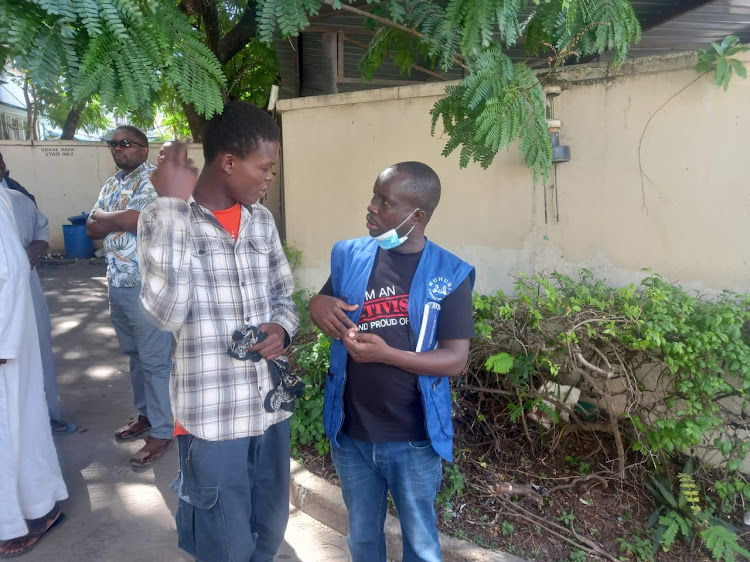 Bakari Mwalimu and Muhuri rapid response officer Francis Auma at the Coast General Teaching and Referral Hospital morgue on Friday.