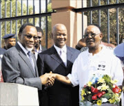 SHAKE ON IT: Johannes Sefatsa with Deputy President Kgalema Motlanthe and Justice Minister Jeff Radebe.  Pic. Unknown.