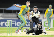 BIG HITTER: New Zealand's Martin Guptill falls over watched by Morne Morkel and Brendon McCullum in the first of their three-match Twenty20 series on Friday.