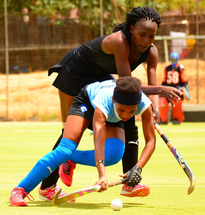 Laura Wabala of Kenyatta University fights for Possession against Vivian Ogweno of Lakers Club during their KHU League match at City Park stadium