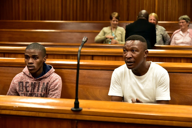 Murder accused Vuyani Sifunda, 21, left, and Mbuyiseli Pikoli, 27, appear in the Port Elizabeth High Court on Monday