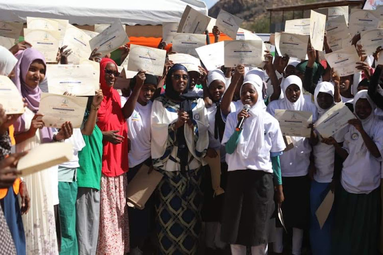 179 girls in sololo sub county who attended the Gaddis Gamme's programme at Obbu girls school posed a photo with marsabit county first lady Alamitu Guyo Jattani on Friday.