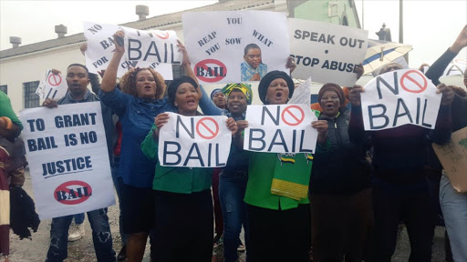 Groups sang struggle songs outside the Port Elizabeth Magistrate’s Court ahead of the appearance of the controversial pastor.