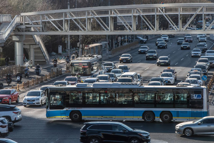 Vehicles travel along a road in Beijing, China, on December 29. Covid outbreaks have peaked in Beijing, Tianjin and Chengdu, although the situation in Shanghai, Chongqing, Anhui, Hubei and Hunan remains serious, according to Wu Zunyou, a top epidemiologist at China’s Centre for Disease Control and Prevention. Picture: BLOOMBERG