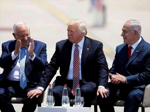 US President Donald Trump (C) sits next to Israel's Prime Minister Benjamin Netanyahu (R) and Israel's President Reuven Rivlin during a welcoming ceremony upon his arrival at Ben Gurion International Airport in Lod near Tel Aviv, May 22, 2017. /REUTERS