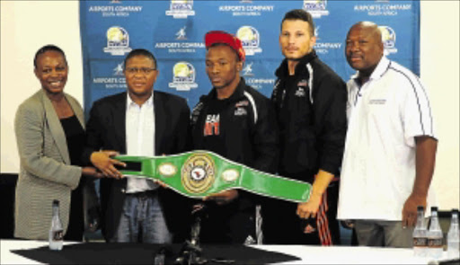 ALL GROWN UP: From left to right: Boxing SA's acting chairperson Ntambi Ravele, Sport Minister Fikile Mbalula, newly-crowned NABF cruiserweight champion Thabiso Mchunu, trainer Sean Smith and BSA's acting chief executive Loyiso Mtya PHOTO: Ryan Toerien
