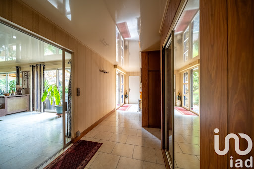 hallway with closets and glass doors in this luxury property for sale in Planguenoual ($1,067,920 - 346 m²)