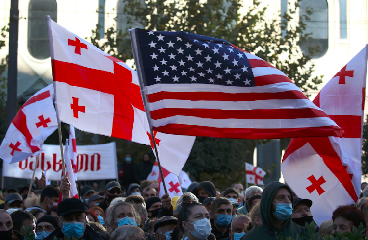 Opposition supporters attend a rally against the results of a parliamentary election in Tbilisi, Georgia on November 8 2020.