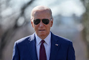 US President Joe Biden walks up to members of the news media to give a statement before boarding Marine One for travel to California from the South Lawn of the White House in Washington, US, February 20, 2024. 