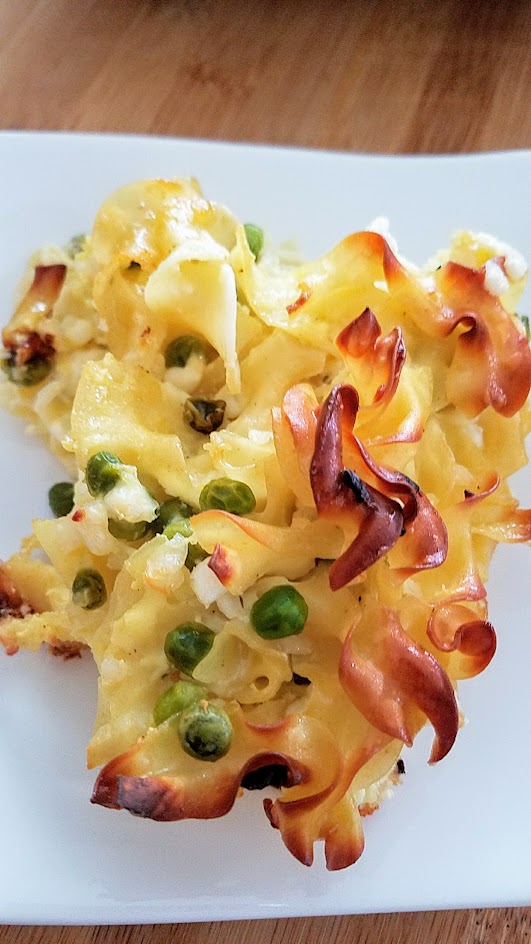 This Savory Cheese Kugel Recipe is my take on the Jewish casserole with egg noodles, butter, eggs, and cheese, with other optional add ins like here, peas and sauteed onions