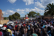 Hundreds of Diepsloot residents gather outside the police station waiting for an audience with police minister Bheki Cele.