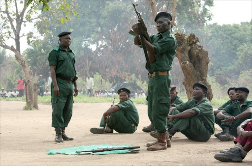 A file photo taken on November 8, 2012 shows fighters of the former Mozambican rebel movement "Renamo" receiving military training in Gorongosa's mountains, Mozambique. Mozambique ex-rebel group Renamo has declared on October 21, 2013 the end of a peace deal signed 21 years ago after the army seized its military base.