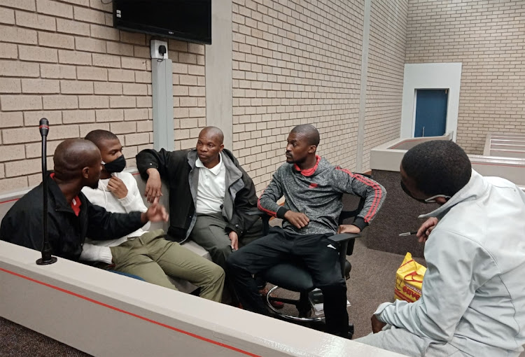 The five men accused of killing five police officers in 2018 in the Mthatha High Court.