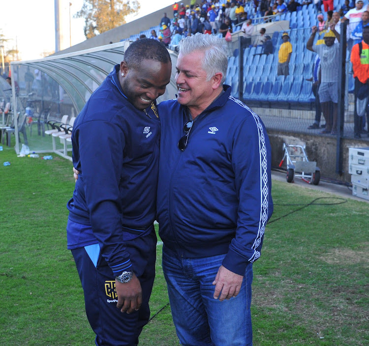 Cape Town City coach Benni McCarthy (L) shares a light moment with his chairman and club owner John Comitis during the MTN8 match against Maritzburg United at Harry Gwala Stadium.