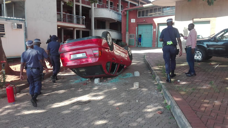 MUT students allegedly overturned a car during protest action at the campus on Monday