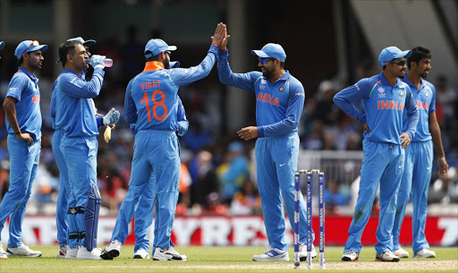 Britain Cricket - India v South Africa - 2017 ICC Champions Trophy Group B - The Oval - June 11, 2017 India's Virat Kohli (L) and Rohit Sharma celebrate the wicket of South Africa's Andile Phehlukwayo Action Images via Reuters / John Sibley