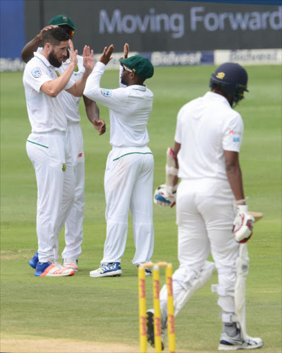 JOHANNESBURG, SOUTH AFRICA - JANUARY 14: Wayne Parnell and Temba Bavuma of the Proteas celebrate the wicket of Suranga Lakmal of Sri Lanka during day 3 of the 3rd test between South Africa and Sri Lanka at Bidvest Wanderers Stadium on January 14, 2017 in Johannesburg, South Africa. (Photo by Lee Warren/Gallo Images)