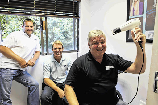 Jacques Kallis, Shane Warne and Leon Schuster at the Advanced Hair Studio in Johannesburg