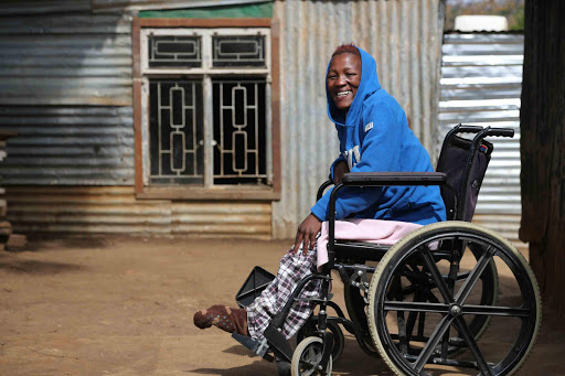 SO HAPPY: Zanele Nete, 29, of Cambridge, who suffers from a blood circulation disorder, is happy with her new wheelchair Picture: ALAN EASON