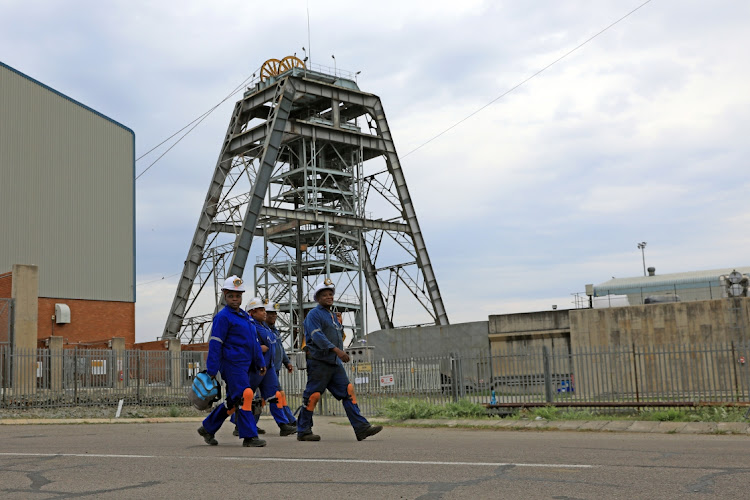 Miners emerge from the 11c vent shaft where 11 miners died and 75 others were injured due to a fault on a conveyance at Impala Platinum mine in Rustenburg.