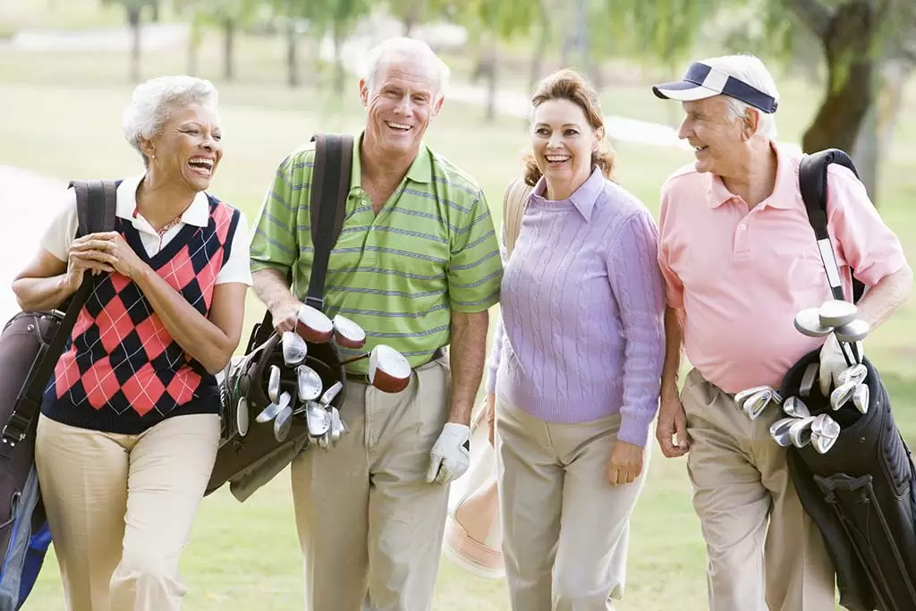 Seniors laughing at a golf course