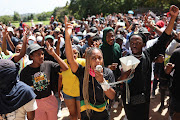 Students gather outside the University of the Witwatersrand's Great Hall in Johannesburg on March 2 2023 to protest about the exclusion of students who are unable to pay historical debt.