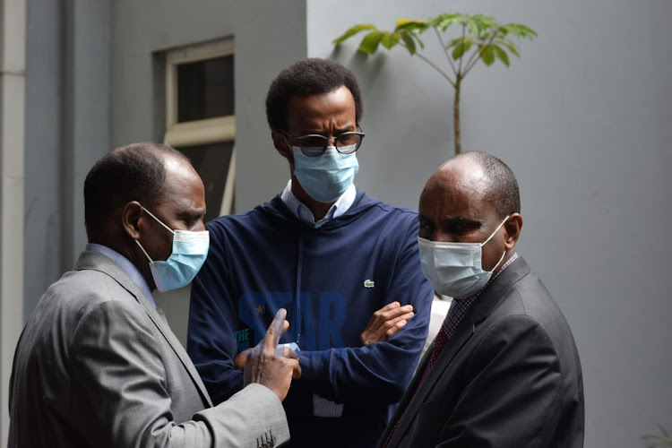 Treasury CS Ukur Yatani discusses burial arrangements with the late Garissa Senator Yusuf Haji's family members.