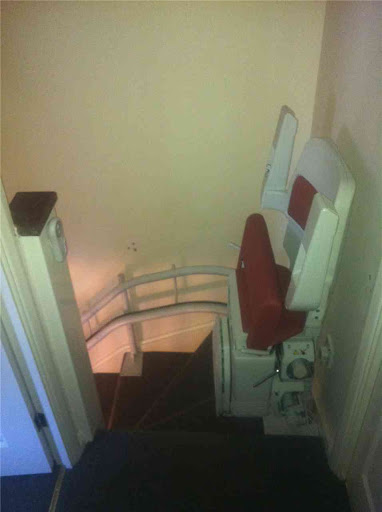 Stairlift folded away, Fitted curved stairlift